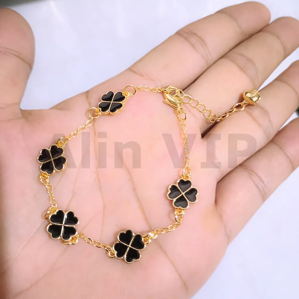 gelang tangan wanita clover hitam 10mm silang titanium gold alin vip glw213